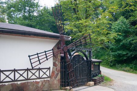 Russia, Sochi - 2019 Sept. The resort village of Paradise Is a place. A building with an imitation of a mill on a mountain road. Summer vacation excursion subtropics holiday extremeのeditorial素材