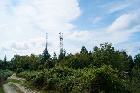 Noon in the mountains of the Caucasus - horizontal photo - mountain landscape. Blue sky with white...