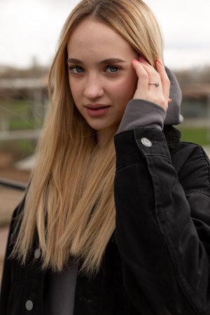 Portrait of a teenage girl who corrects long bleached hairの写真素材