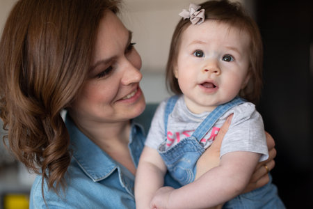 Mom looks at her little daughter