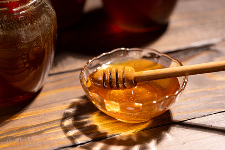 Fresh floral honey in a glass bowlの写真素材