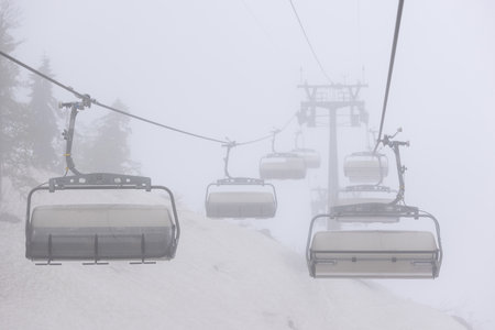An empty cable car on a foggy dayの写真素材