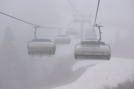 An empty cable car on a foggy dayの写真素材