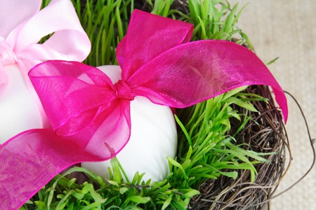 Basket with Easter Eggs in Grass Close