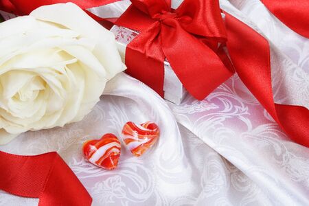 Valentine Still Life Red Hearts and Gift over Silkの写真素材
