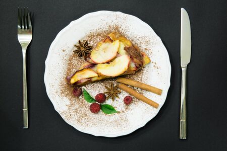 Christmas cake with cinnamon rolls anise star rasberry, apple cake の写真素材