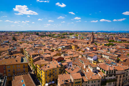 Panoramic cityscape of Verona, Veneto, Italy. Orange tiling medieval roofs. Bright sunny summer day...