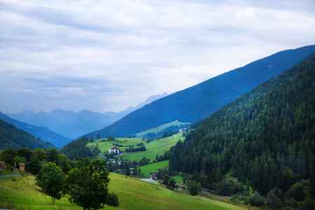 Dolomites Apls, Switzerland panorama. Dolomites Alps landscape, green valley with high mountains and blue sky.の写真素材