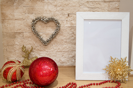 Christmas mock up, golden snowflafe, greeting card, red beads, red and golden, christmas balls and brick wall background. Copy space. Christmas decorations.の写真素材