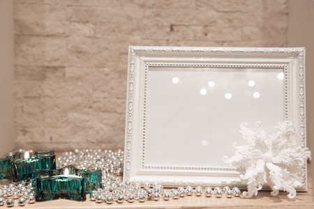 Christmas greeting card background, mock up. Turquoise star candlesticks, glittering silver beads and white glittering snowflake.の写真素材