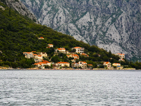 Kotor bay, Montenegro. View from boat, different building and mountains.