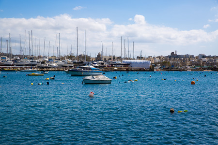 Panoramic view in Sliema, sailing boat and beautiful blue waters of Mediterranean sea. Malta country.の写真素材