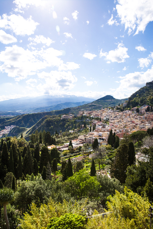 Etna volcano and Taormina town aerial panoramic view. Roofs of a lot of buldings. Sicily island, Italy.の写真素材