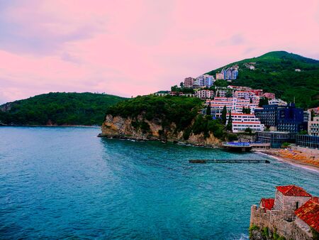 Budva evening view. Turquoise waters of Mediterranean sea and pink sunset. Montenegro.の写真素材