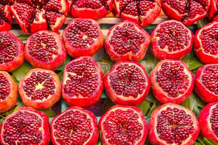 Tasty organic pomegranates, healthy tasty fruit, bright colors. 