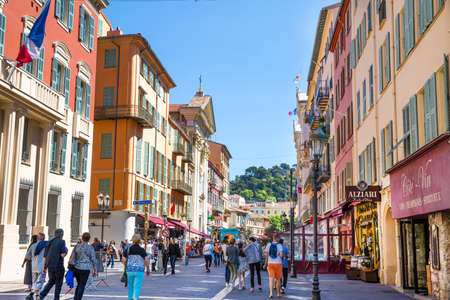 Nice, France - April 18 2017. Old bright colorful buildings in Nice street, French riviera, France.のeditorial素材