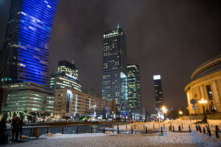 Warsaw, Poland - 19 January 2018. Warsaw business center at night. Winter, everything is covered by snow.のeditorial素材