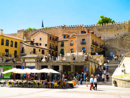 Segovia, Spain May -30 2015. Restaurant and city walls in Segovia. Bright sunny day.