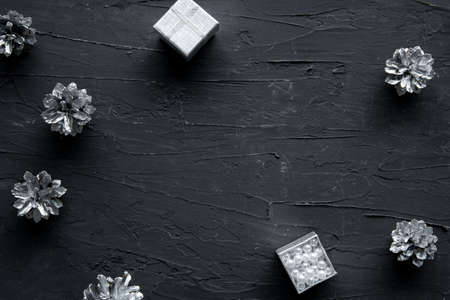 Silver bright pine cones frame with empty space for text. Christmas and New Year holidays. Festive decoration.の写真素材