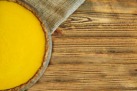 Pumpkin pie dessert on rustic wooden table, top view. Space for text, copy space.の写真素材