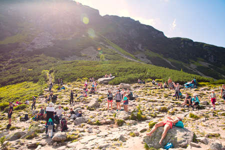 August 7, 2021, tatra mountains, Poland. Beautiful sunny day near Czarny Staw Gansienicowy (Black Gansienicowy Lake). people relax.のeditorial素材