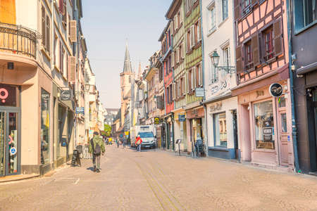 2 of May 2022, Strasbourg, France. Cozy beautiful street in Strasbourg, with old medieval architecture. Restaurants, local shops and people.のeditorial素材