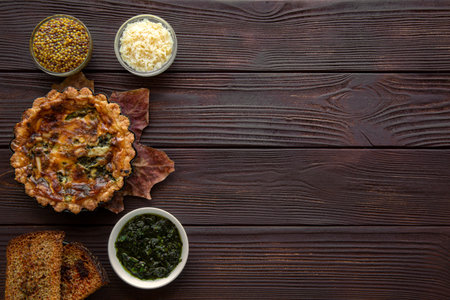 Tasty vegetables seasonal mini pies on brown rustic wooden table, top view. Space for text, copy space.の写真素材