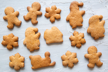 Assortment of gingerbread cookies on gray table background, top view.の写真素材