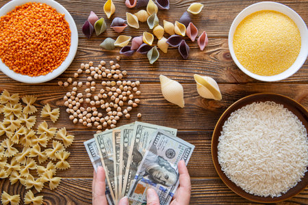 Economic situation in the world. Increase costs for food expenses. Food and money concept. Dollar bills.の写真素材
