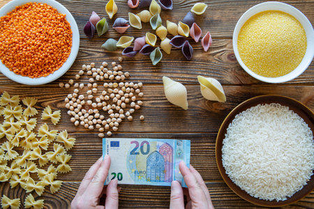 Economic situation in the world. Increase costs for food expenses. Food and money concept.の写真素材
