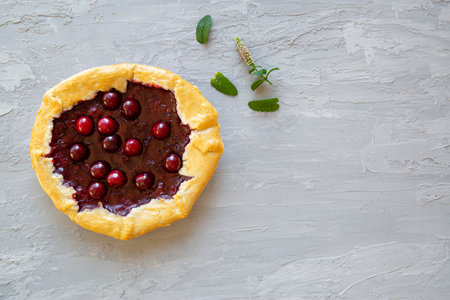 Tasty cherry galette on gray background, top view.の写真素材