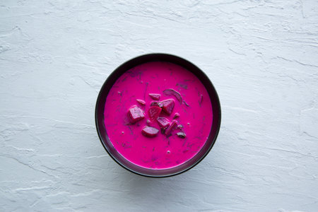 Cold summer soup cooler on gray background, top view.の写真素材