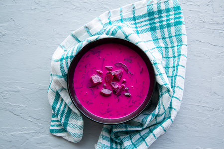 Delicious cold summer soup with beetroot and cucumber, top view.の写真素材