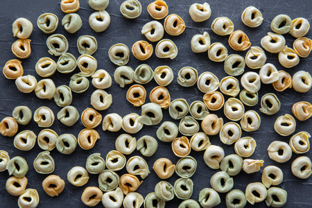 Dry italian tortellini background, top view.の写真素材