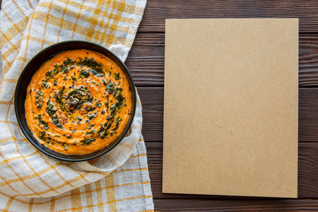 Tasty creamy soup on rustic wooden background, copy space, space for text and recipe, top view.の写真素材