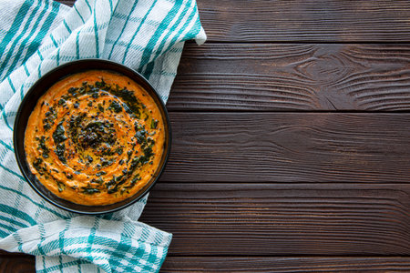 Tasty creamy soup on rustic wooden background, copy space, space for text and recipe, top view.の写真素材
