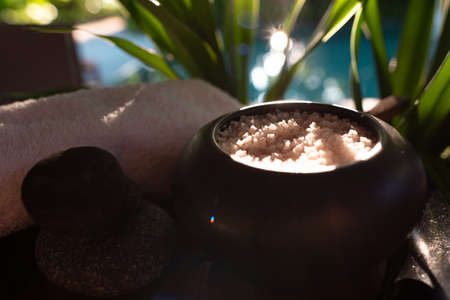 Balinese spa setting, white frangipani with coconut, vanilla sea salt. Hot Stone Massage Set.の写真素材