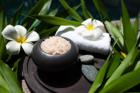 Spa treatments on wooden background top view. Spa and beauty threatment. Body care wiht hot stones...