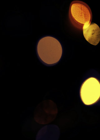 Abstract circular bokeh background, defocused lights in the dark