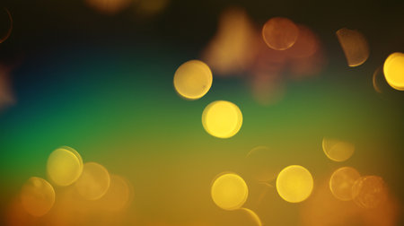 Abstract circular colorful bokeh from the party light on black backgroundの写真素材