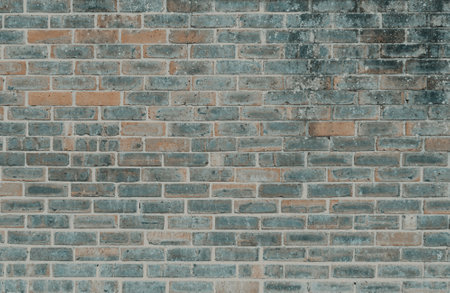 Old brick wall texture background in dark color paletteの写真素材