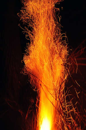 Big flame with many sparks in the darkの写真素材