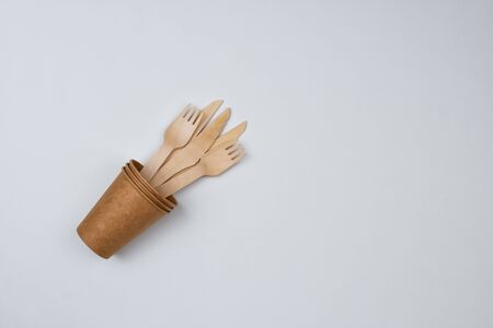 Zero waste concept. Forks and knives in a paper cup on a white background. View from the top.の写真素材