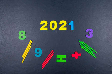 Multicolored colorful numbers, counting sticks, math signs on a chalkboard. Back to school....