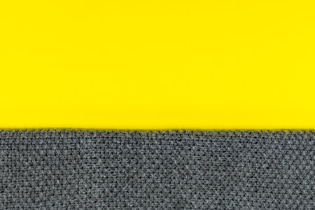 The background is divided into two colors, yellow and gray. Demonstration of trendy colors 2021. Place for an inscription.の写真素材