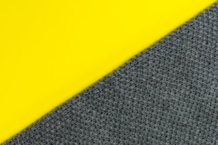 The background is divided diagonally into two colors: yellow and gray. Demonstration of trendy...