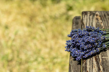 Bouquet of lavender flowers on a wooden background. Place for text. Selective focus. copyspaceの写真素材