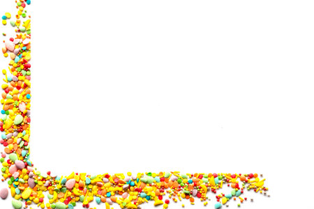 Easter decor concept. Frame with sugar sprinkles. Copyspace.