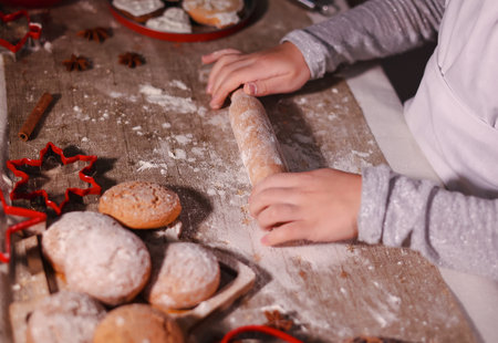 A girl enjoys Christmas cookies.の写真素材
