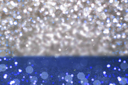 Bokeh silver and blue glitter background with soft blurred light effectの写真素材